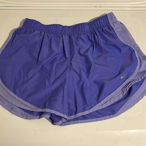 Purple Nike running shorts that are a size XL in excellent condition